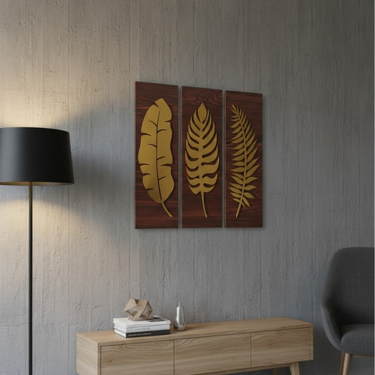Decorative wall art with gold leaf designs on a wooden panel in a modern interior setting.