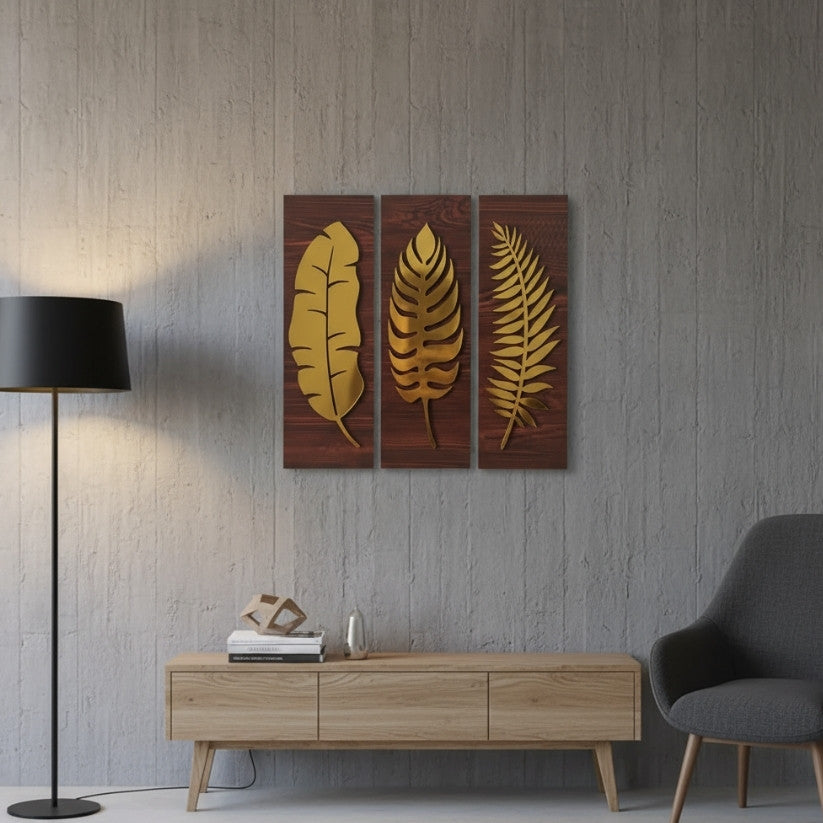 Decorative wall art with gold leaf designs on a wooden panel above a wooden console table in a room.